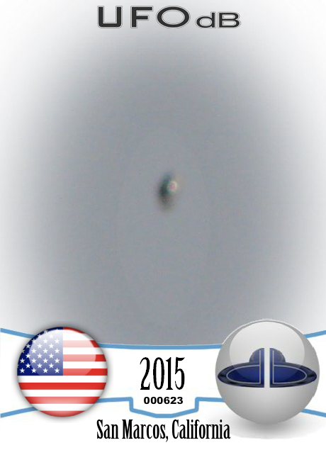 Shiny Upside-down Teardrop UFO rotating in the sky San Marcos CA USA UFO CARD Number 623