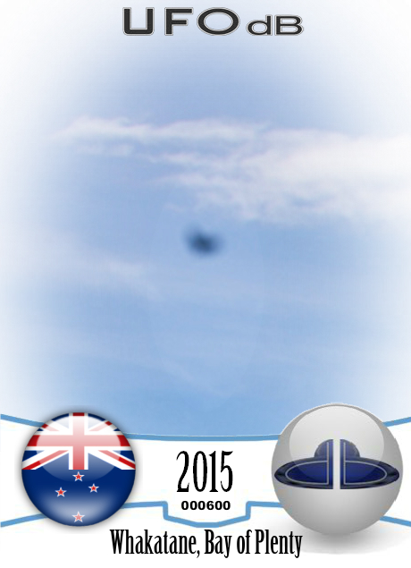 Stationary dark UFO over ohope beach near Whakatane NZ 2015 UFO CARD Number 600