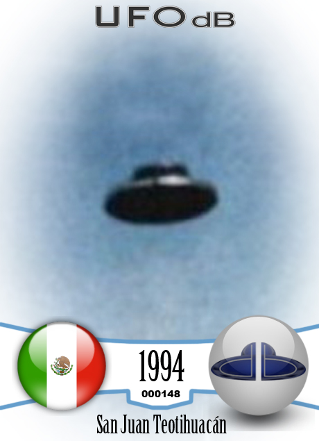 UFO picture - UFO in clear blue sky over one of the pyramid | Mexico UFO CARD Number 148