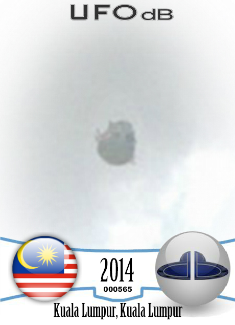 UFO near the Petronas Twin Towers in Kuala Lumpur, Malaysia - May 2014 UFO CARD Number 565