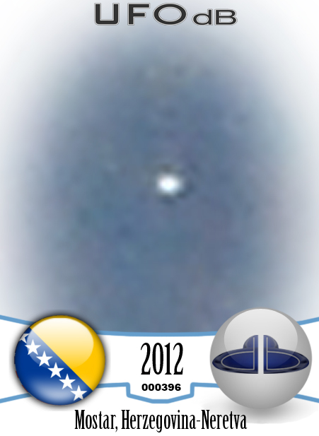 White saucer ufo over the city of Mostar in Bosnia caught on picture UFO CARD Number 396