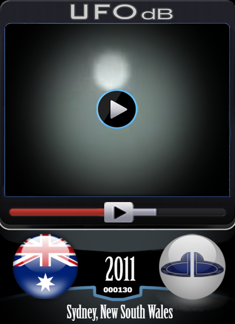 White orb UFO in the clouds on this video over Sydney, Australia 2011 UFO CARD Number 130